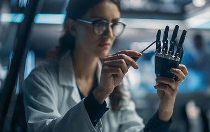 Engineer working on robotic hand