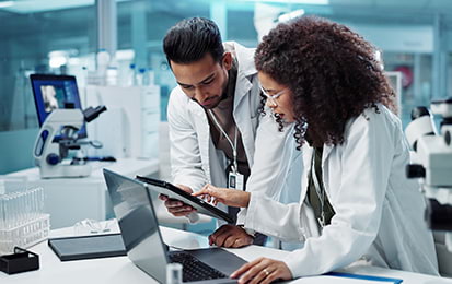 Pharmacists working on a laptop